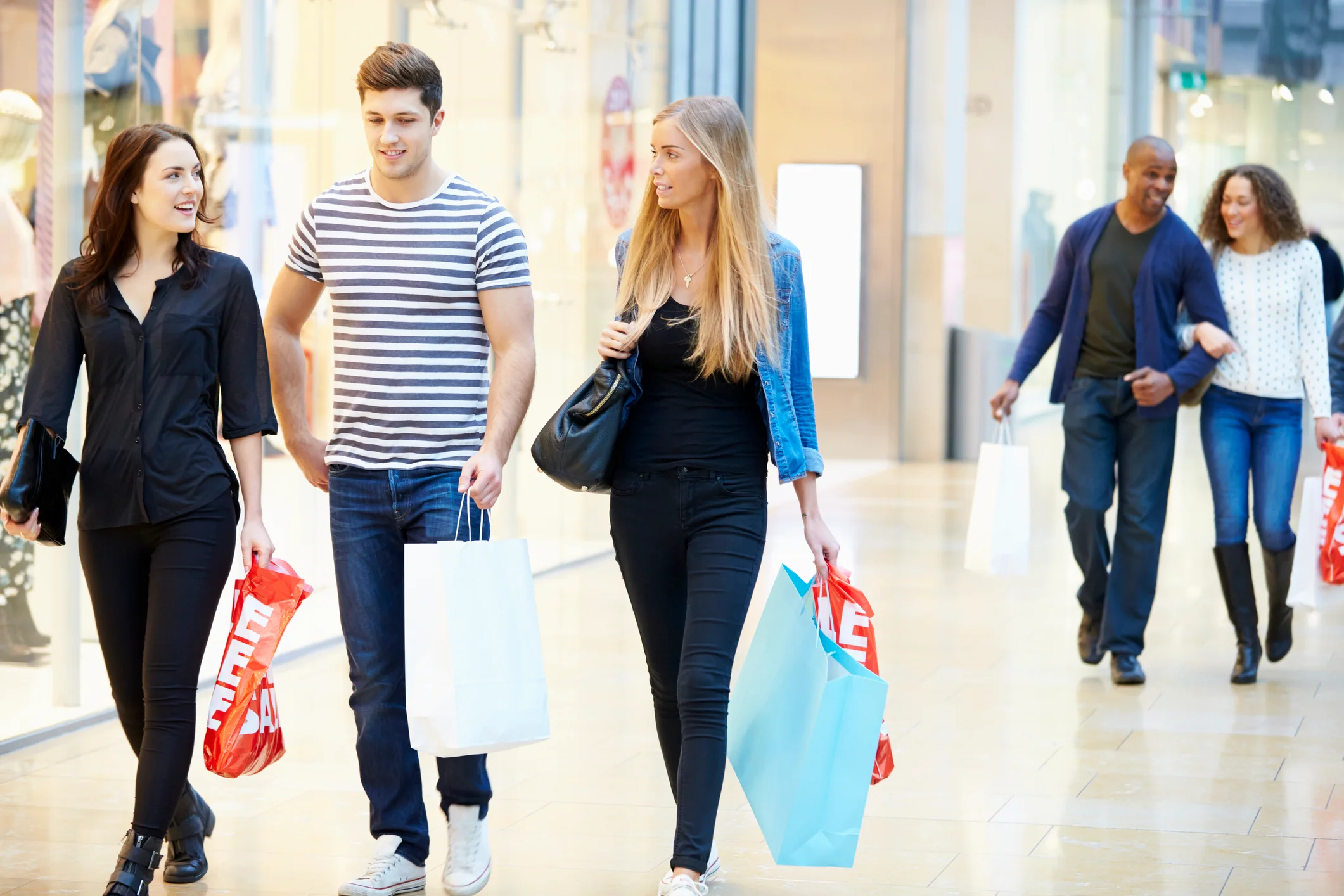 shopping mall friends couple source getty